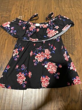 Fashion Magazine Black Off-Shoulder Floral Blouse with Red & Blue Accents